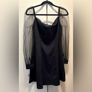 Elegant Black Dress with Sheer Polka Dot Sleeves